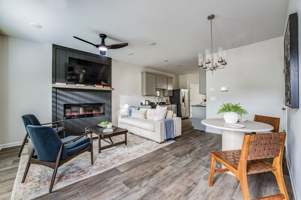 Furnished Hamlet living and dining area with fireplace