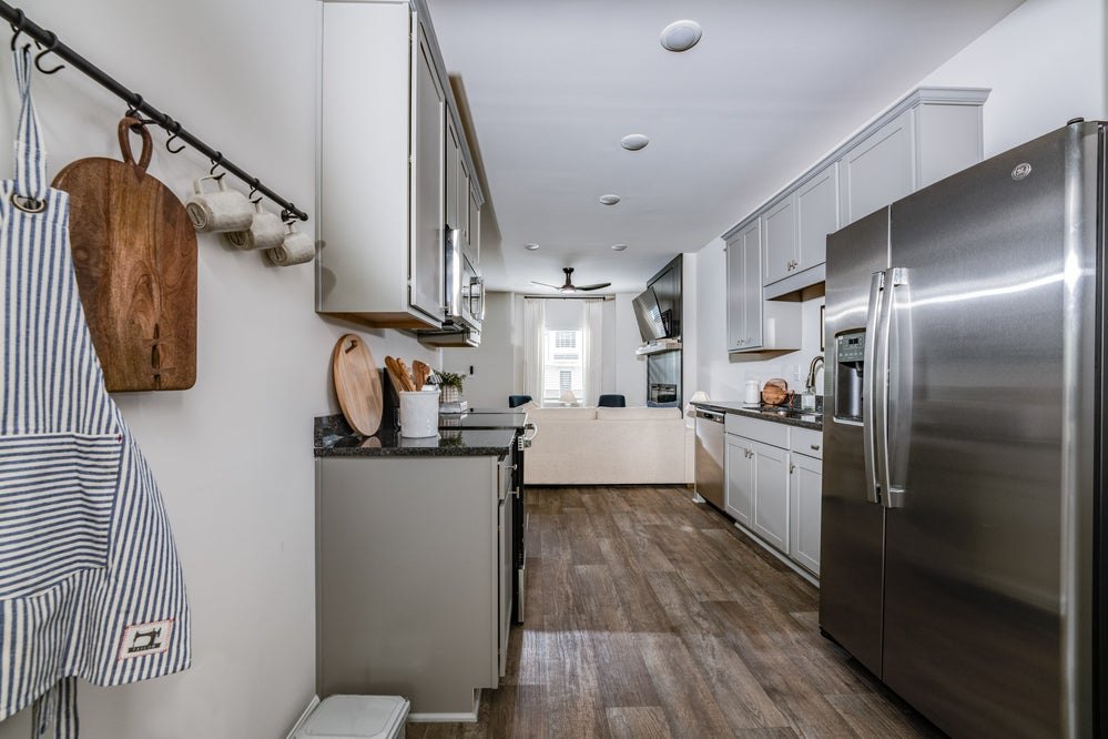 Kitchen interior at The Hamlet with cabinets and stainless steel appliances